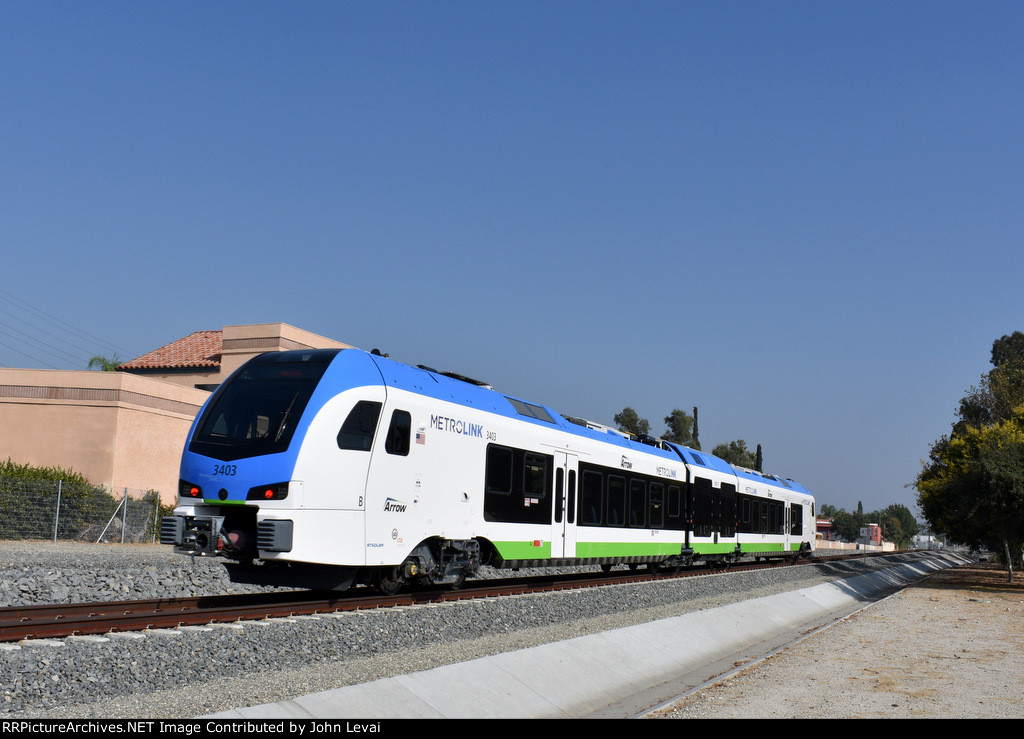 Stadler DMU Car # 3403 heading away from the W. Colton Avenue Grade Crossing 